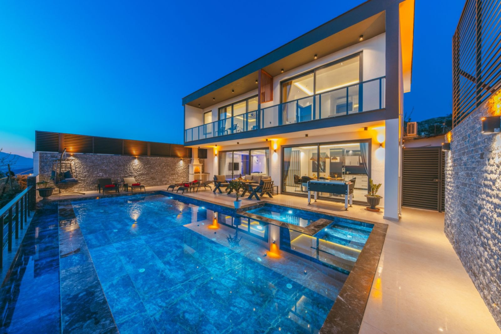 Villa terrace lounge area beside a swimming pool