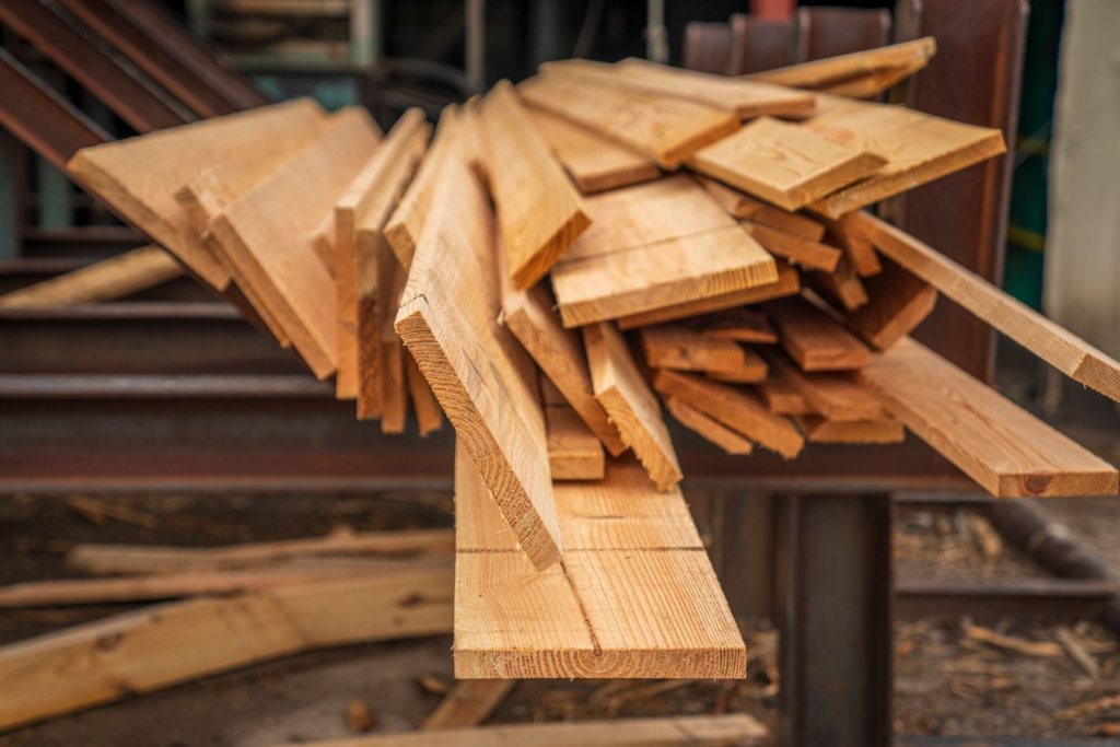 air-dried lumber stacked with stickers in an open-air drying yard
